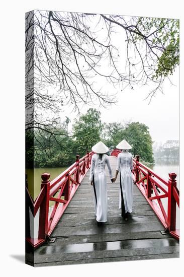 Vietnam, Hanoi, Hoan Kiem Lake. Walking on Huc Bridge in Traditional Ao Dai Dress-Matteo Colombo-Premier Image Canvas