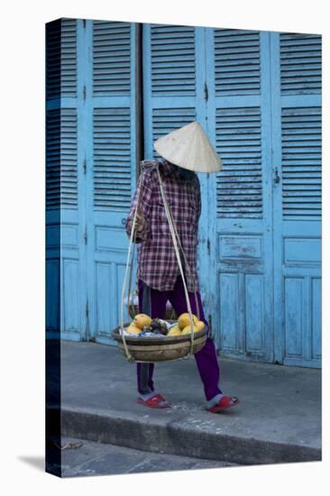 Vietnam. Street vendor with fruit and vegetable basket. Hoi Anh.-Tom Norring-Premier Image Canvas