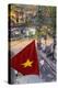 Vietnamese Flag and Street Scene, Hanoi, Vietnam-Peter Adams-Premier Image Canvas