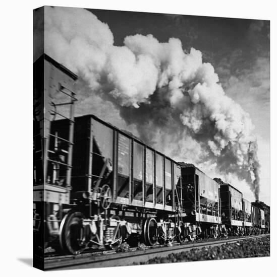 View of a Railcar Loaded with Iron Ore Moving Along the Tracks-Charles E^ Steinheimer-Premier Image Canvas