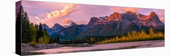 View of rail bridge over river and Three Sisters Mountain Canmore, Alberta, Canada-Panoramic Images-Premier Image Canvas