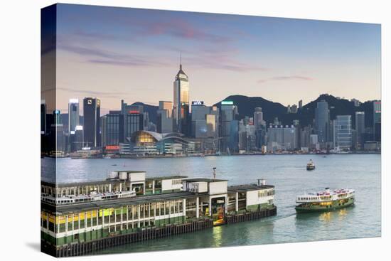View of Star Ferry Terminal and Hong Kong Island Skyline at Dusk, Hong Kong, China, Asia-Ian Trower-Premier Image Canvas