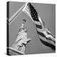 View of Statue of Liberty and American Flag-Bettmann-Premier Image Canvas