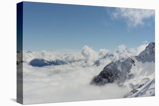 View on Winter Snowy Mountains and Blue Sky above Clouds, Krasnaya Polyana, Sochi, Russia-wasja-Premier Image Canvas