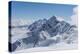 View on Winter Snowy Mountains and Blue Sky above Clouds, Krasnaya Polyana, Sochi, Russia-wasja-Premier Image Canvas