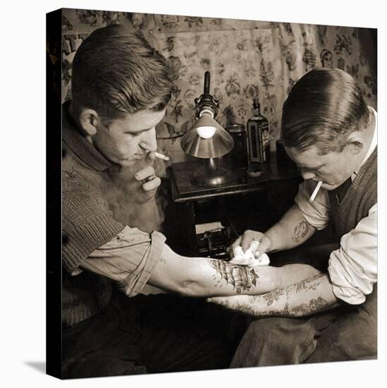 Vintage Shot of a Man Being Tattooed-null-Premier Image Canvas