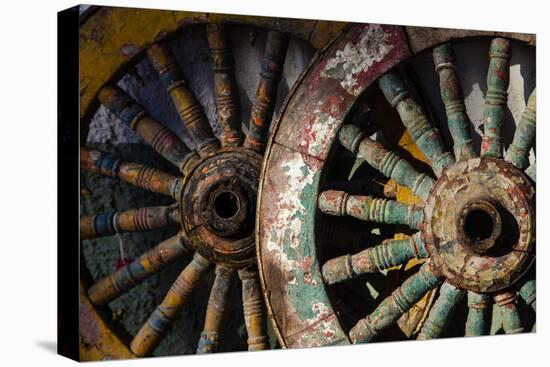 Wagon wheels at antiques store.-Larry Ditto-Premier Image Canvas