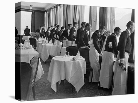 Waiters in the Grand Hotel Dining Room Lined Up at Window Watching Sonja Henie Ice Skating Outside-Alfred Eisenstaedt-Premier Image Canvas