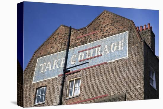 Wall Mural Inscribed with 'Take Courage' Slogan on an End of Terrace Brick House Built around 1807-Julian Castle-Stretched Canvas