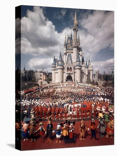 Walt Disney Characters and Park Staff Posing En Masse in Front of Cinderella's Castle-Yale Joel-Premier Image Canvas