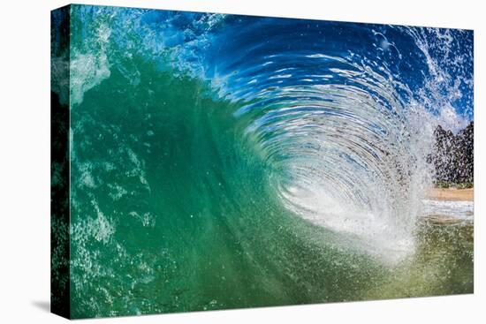 Water shot of a tubing wave off a Hawaiian beach-Mark A Johnson-Premier Image Canvas