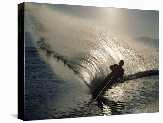 Waterskier Silhouetted with Sun Shining Through Water-null-Premier Image Canvas
