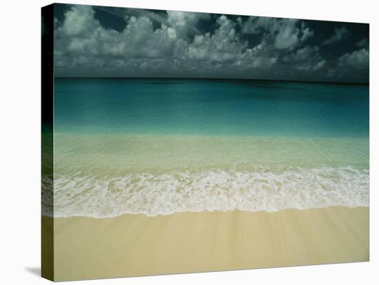 Wave Rolls over a Tranquil Beach in the Marshall Islands-Bill Curtsinger-Stretched Canvas