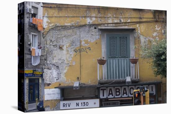 Weather and Sun-Beaten Corner Facade of a Residence on Top of a Shop, Naples, Campania, Italy-Natalie Tepper-Stretched Canvas