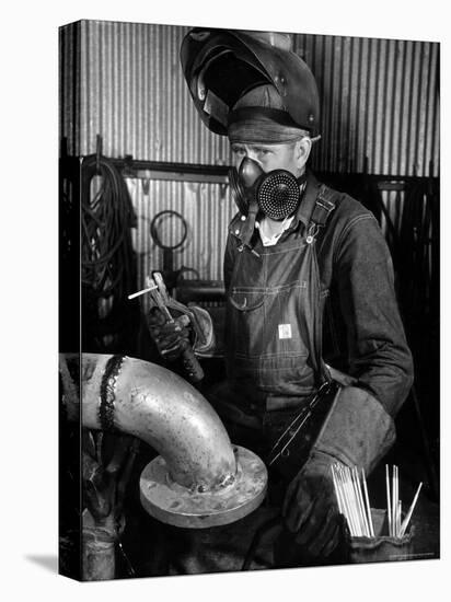 Welder Working in the Shipbuilding Industry-George Strock-Premier Image Canvas