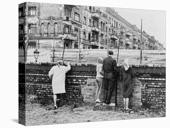 West Berliners Peer over the Infamous Berlin Wall in 1962-null-Stretched Canvas
