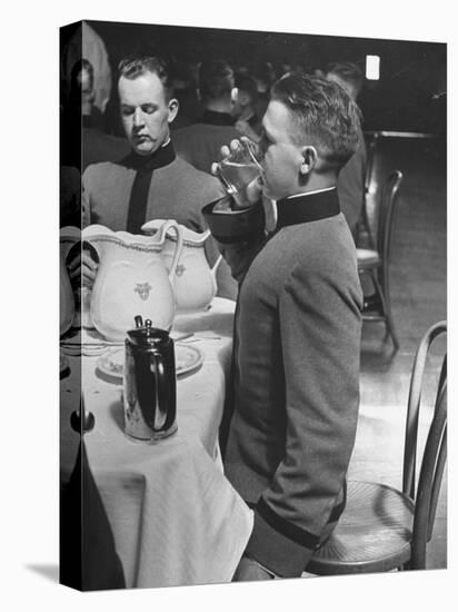 West Point Cadet Drinking a Glass of Water as He Sits at Attention in Mess Hall at the Academy-Alfred Eisenstaedt-Premier Image Canvas