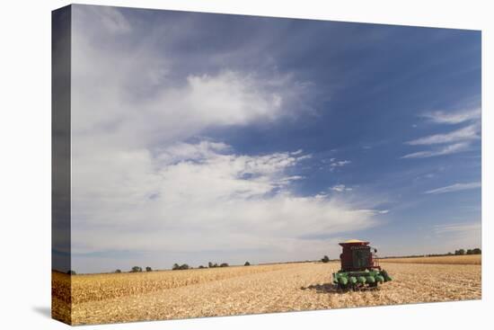 Wheat Field and Combine, North Platte, Nebraska, USA-Walter Bibikow-Premier Image Canvas