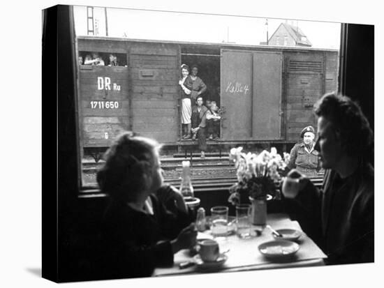 Wife and Daughter of US Soldier in First Class Dining Car Looking at German "Expelles" in Boxcars-Walter Sanders-Premier Image Canvas