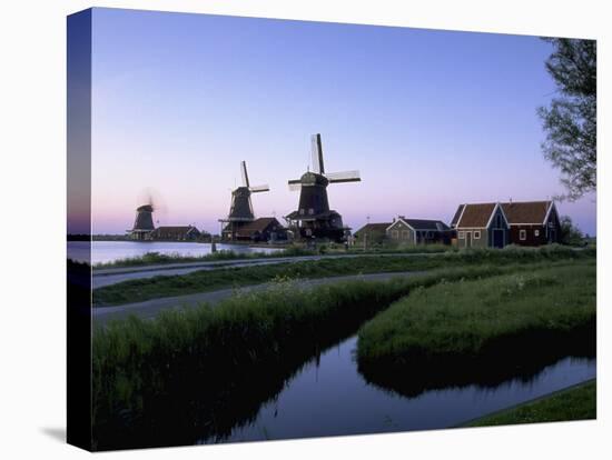 Windmills at Sunset, Zaanstad, North Holland-Walter Bibikow-Premier Image Canvas