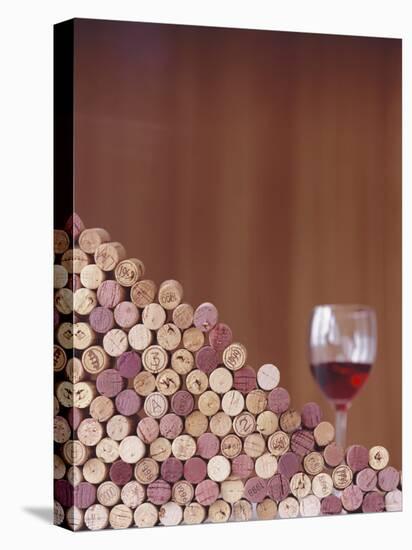 Wine Corks, Piled Up, and a Glass of Red Wine-Henrik Freek-Premier Image Canvas