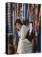 Woman and Baby, Cloth Shopkeeper in Temple Square, Bodhnath, Kathmandu, Nepal-Anthony Waltham-Premier Image Canvas
