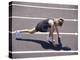 Woman at the Starting Pose on a Running Track-null-Premier Image Canvas