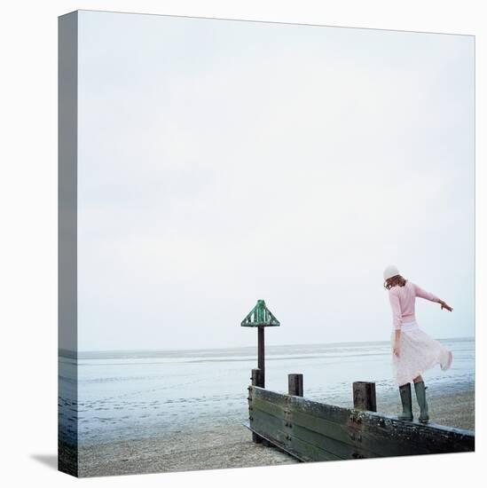 Woman Balancing on a Breakwater-null-Premier Image Canvas