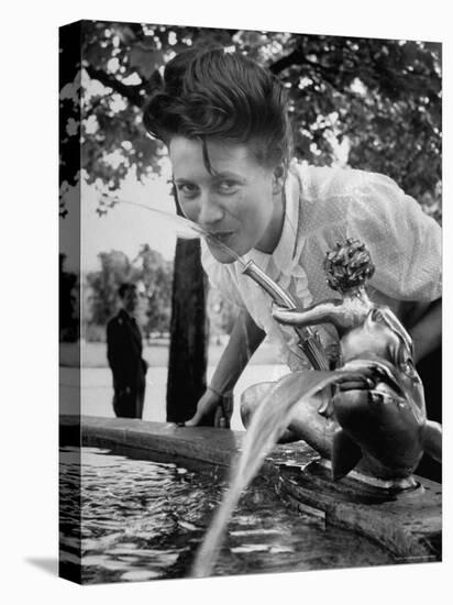 Woman Drinking from a Water Fountain-Yale Joel-Premier Image Canvas