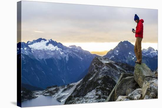 Woman Drinks Her Morning Coffee On Top Of A Mountain In The North Cascades-Hannah Dewey-Stretched Canvas