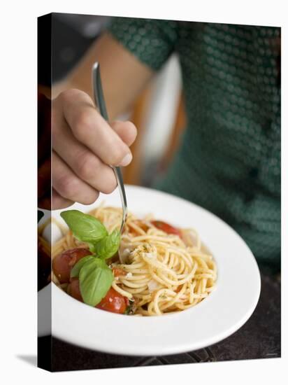 Woman Eating Spaghetti with Tomatoes, Parmesan and Basil-null-Premier Image Canvas