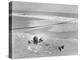 Woman Floating in a Large Puddle of Water Near the Surf While at the Beach-Wallace G^ Levison-Premier Image Canvas