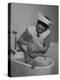 Woman Giving a Baby a Bath at a Nursery-null-Premier Image Canvas