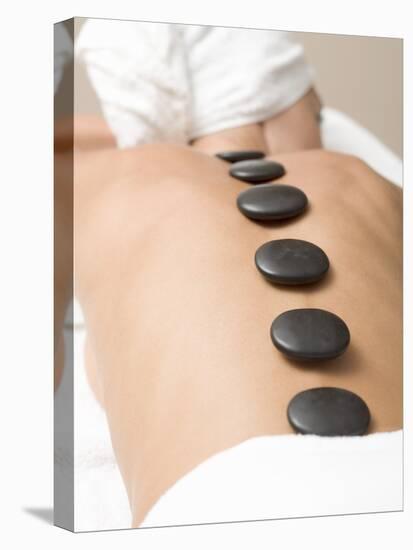 Woman Having Lastone Therapy (Healing Therapy Using Stones)-null-Premier Image Canvas
