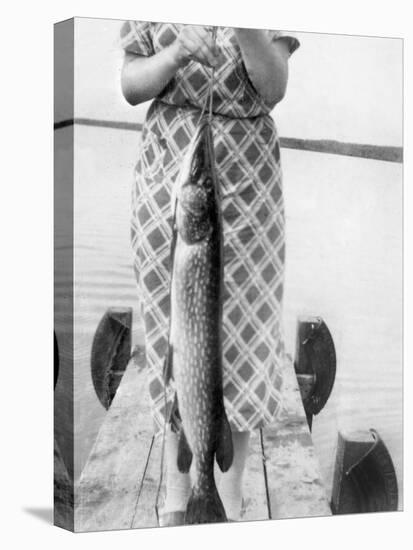 Woman Holds on Large Northern Pike on a Lake Pier, Ca. 1950-null-Premier Image Canvas