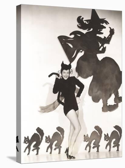 Woman in Cat Costume Posing Against Halloween Themed Wall-null-Stretched Canvas