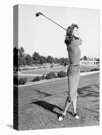 Woman on the Driving Range Swinging a Golf Club-null-Stretched Canvas