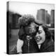 Woman Profiling a Big Smile While Adoring Her Poodle Wearing Large Swiss Watch on Dog Collar-Yale Joel-Premier Image Canvas
