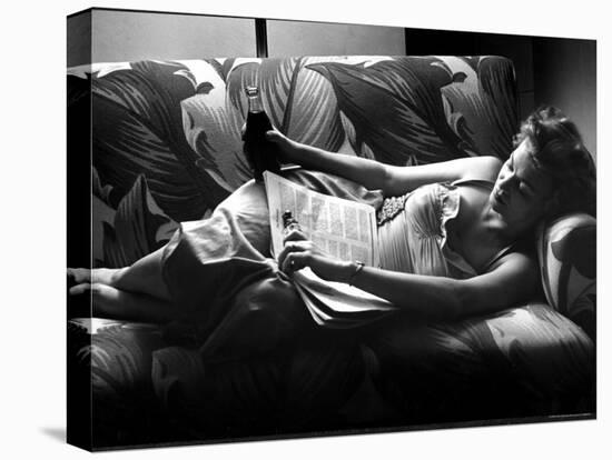 Woman Relaxing on Sofa, Reading and Drinking a Coke-Nina Leen-Premier Image Canvas