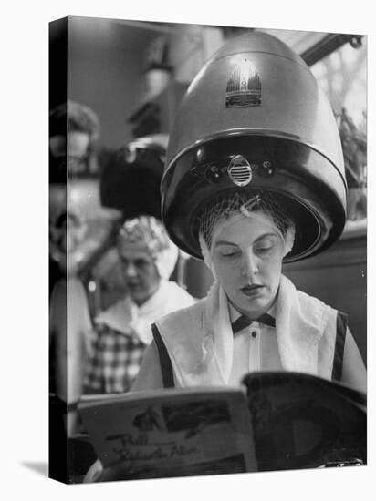 Woman Sitting under Hair Dryer Reading a Magazine-Gordon Parks-Premier Image Canvas