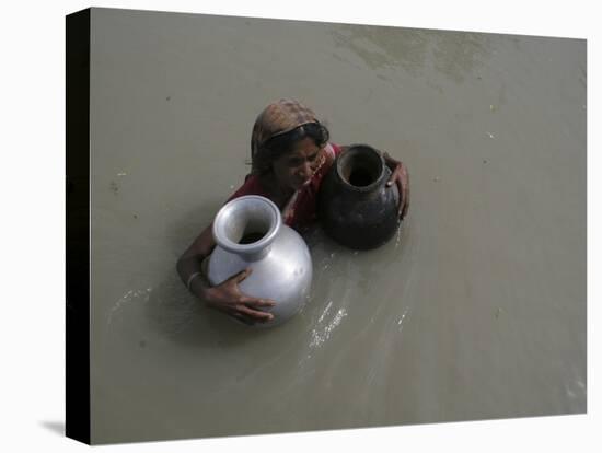 Woman Wades Through Flood Waters to Collect Drinking Water at Kakadhowa Village in India-null-Premier Image Canvas