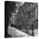 Woman Walking Down Street in Front of Apartment Buildings-Ed Clark-Premier Image Canvas