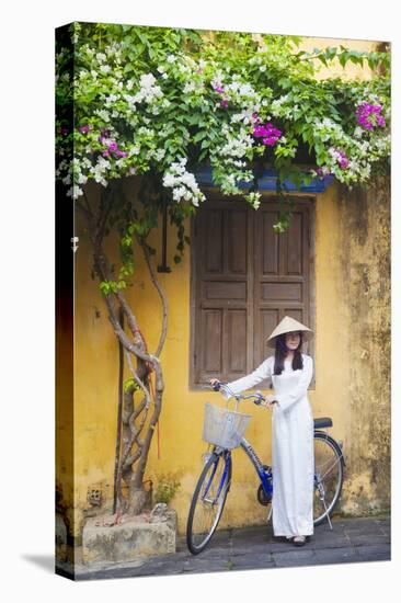 Woman Wearing Ao Dai Dress with Bicycle, Hoi An, Quang Ham, Vietnam-Ian Trower-Premier Image Canvas