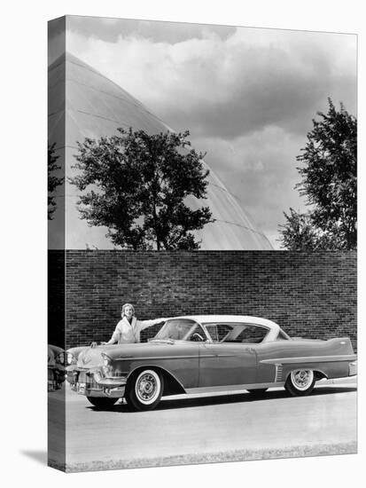 Woman with a 1957 Cadillac Coupe De Ville-null-Premier Image Canvas