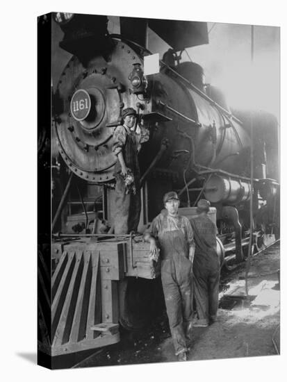 Women Rail Workers Standing at Work on Engine of Train, During WWI at Great Northern Railway-null-Premier Image Canvas