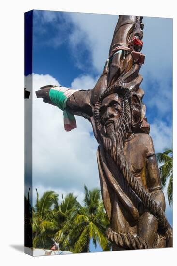 Wooden carvings on the Monument des Dix-Neuf (Monument of 19), Ouvea, Loyalty Islands, New Caledoni-Michael Runkel-Premier Image Canvas