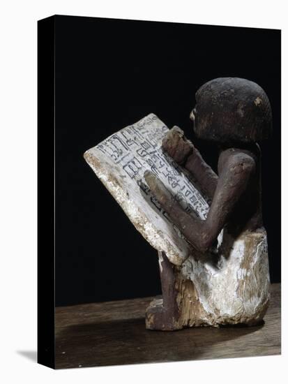 Wooden model of a scribe, Ancient Egyptian, possibly Middle Kingdom-Werner Forman-Premier Image Canvas