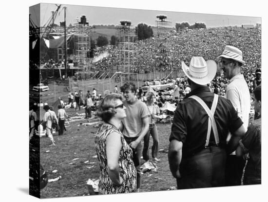 Woodstock, Farmer Max Yasgur Looks On As His Grounds Are Used For Woodstock Festival, 1970-null-Stretched Canvas