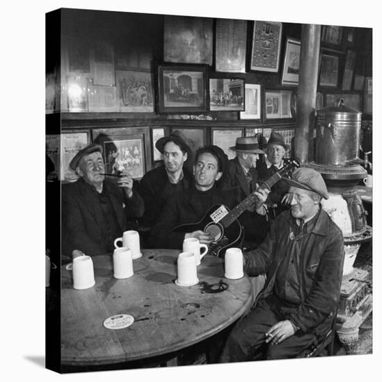 Woody Guthrie Playing and Singing for Patrons of Mcsorley's Bar-Eric Schaal-Premier Image Canvas