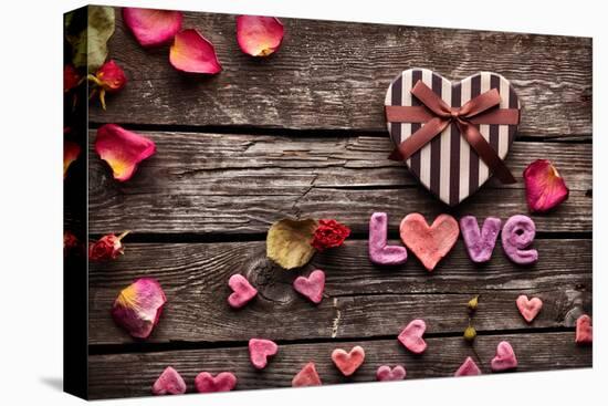 Word Love With Heart Shaped Valentines Day Gift Box On Old Vintage Wooden Plates-ouh_desire-Premier Image Canvas